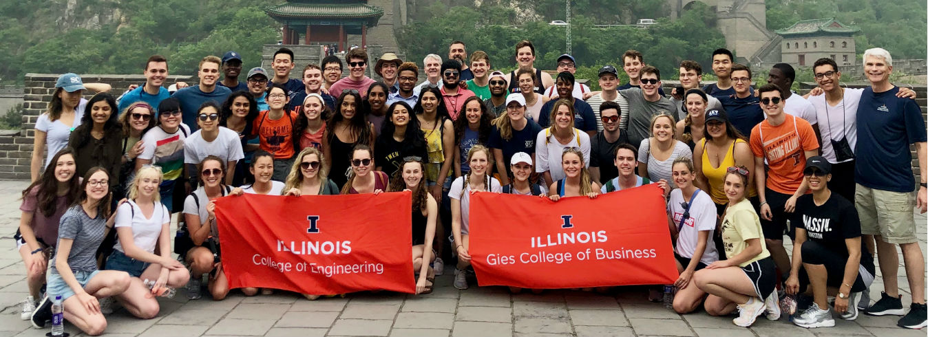 Hoeft TM students holding a Gies Business flag while on a trip to China